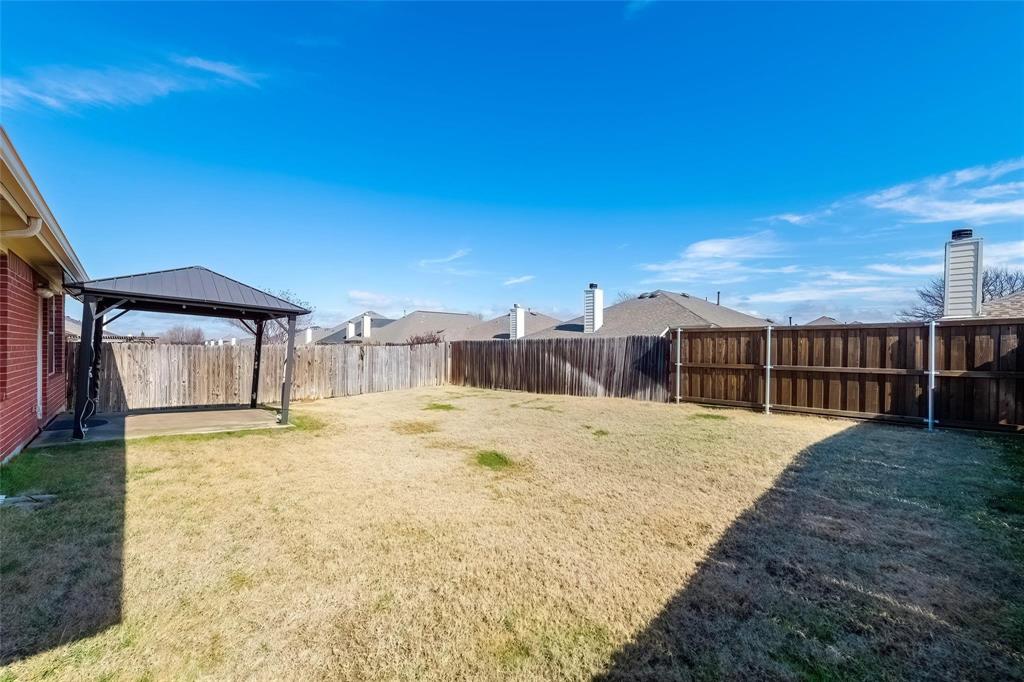 2716 Dawn Spring Drive Little Elm, TX 75068 - Photo 23 of 23 a view of a swimming pool with a yard