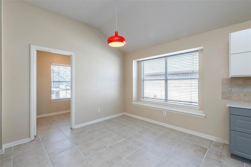 2716 Dawn Spring Drive Little Elm, TX 75068 - Photo 10 of 23 an empty room with windows and a chandelier fan