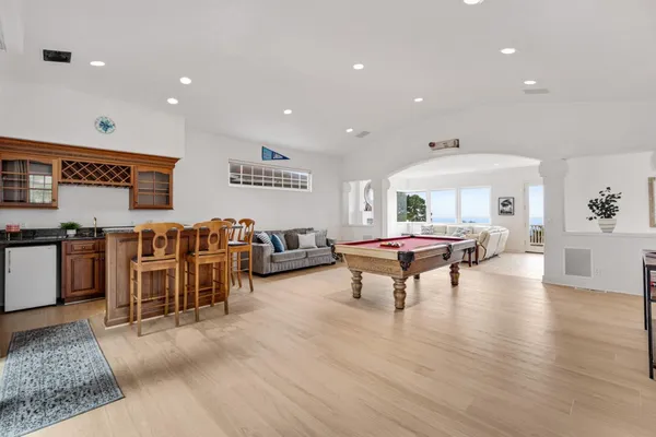 a living room with fireplace furniture and a flat screen tv
