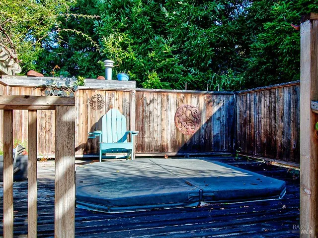 a view of a house with backyard sitting area and garden