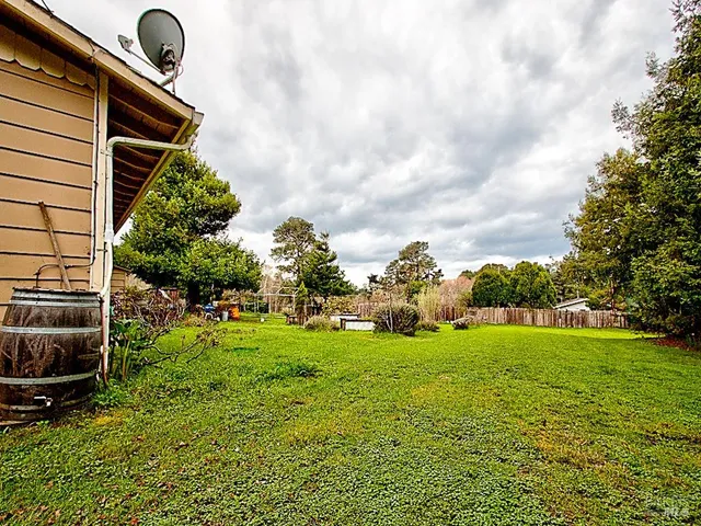 a view of a large body of water with a building in the background