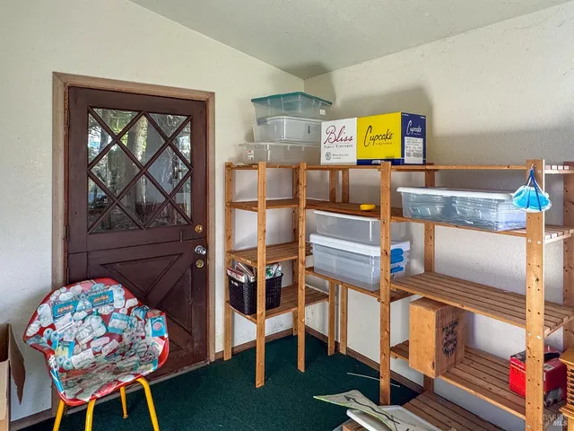 an aerial view of a house with a yard swimming pool and outdoor seating