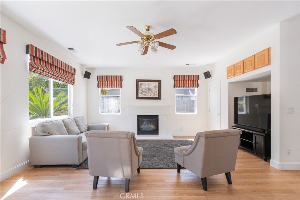 781 Angus Street Paso Robles, CA 93446 - Photo 11 of 34 Family room with area for a large TV, cabinets and a large closet, ceiling fan