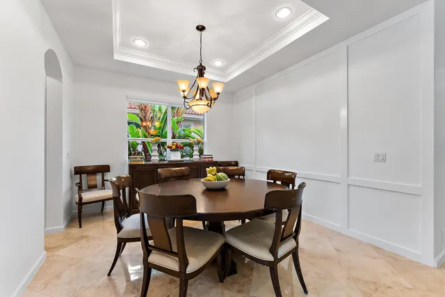 a bedroom with a bed and a television