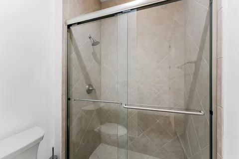 a view of a patio with a table and chairs