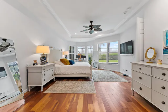 a view of a house with backyard and a tree