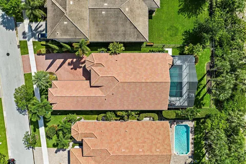 an aerial view of a house with a yard and a garden