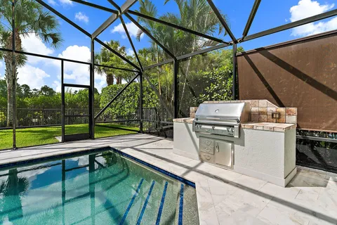 a view of a swimming pool with a patio