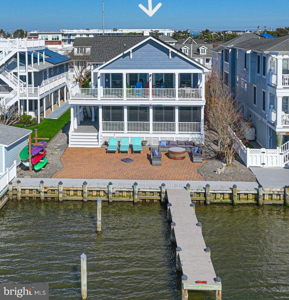 1502 Bay Street Fenwick Island, DE 19944 - Photo 1 of 62 a house with river in front of it