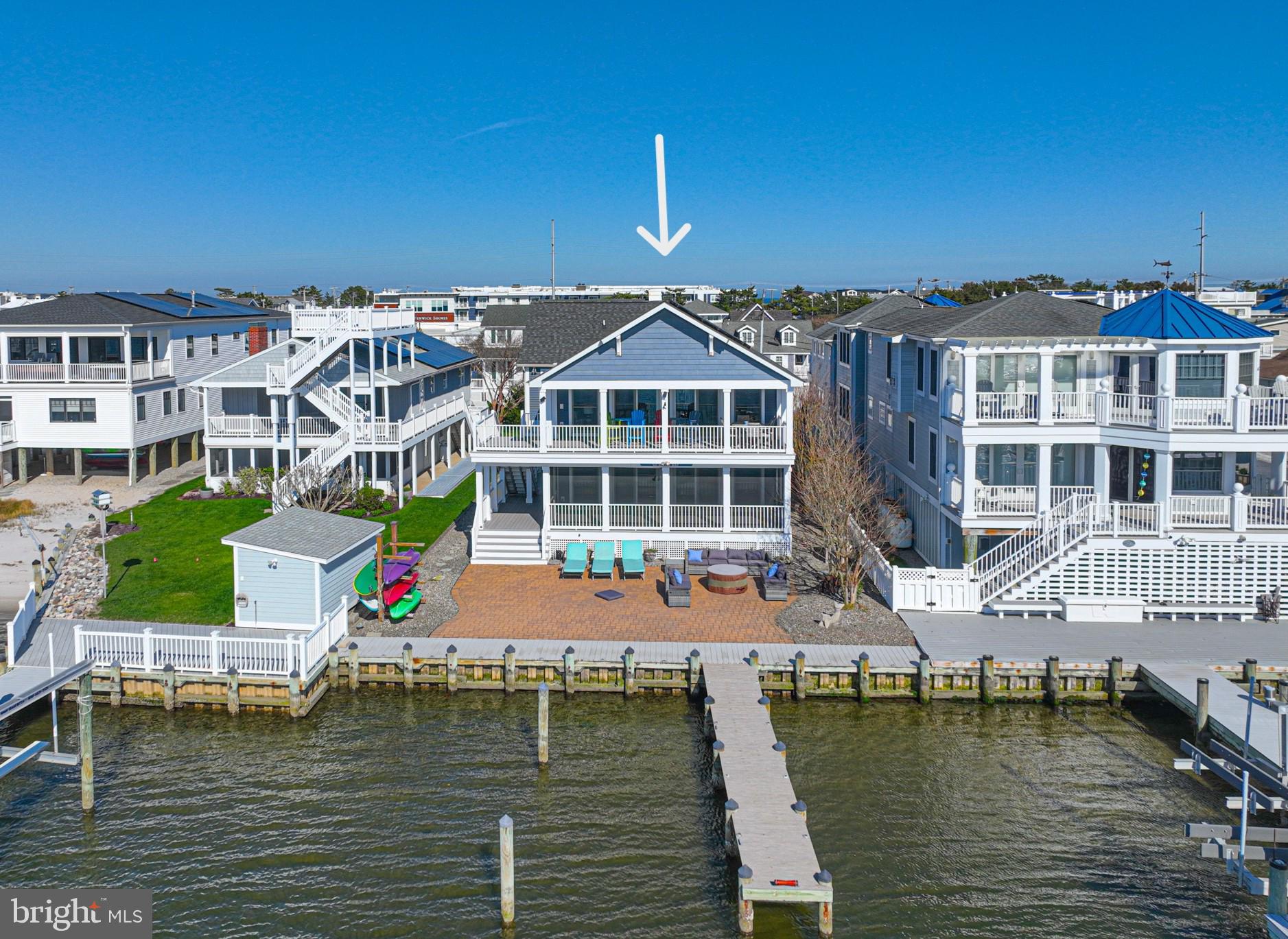 1502 Bay Street Fenwick Island, DE 19944 - Photo 2 of 62 a front view of a building with lake view and boat