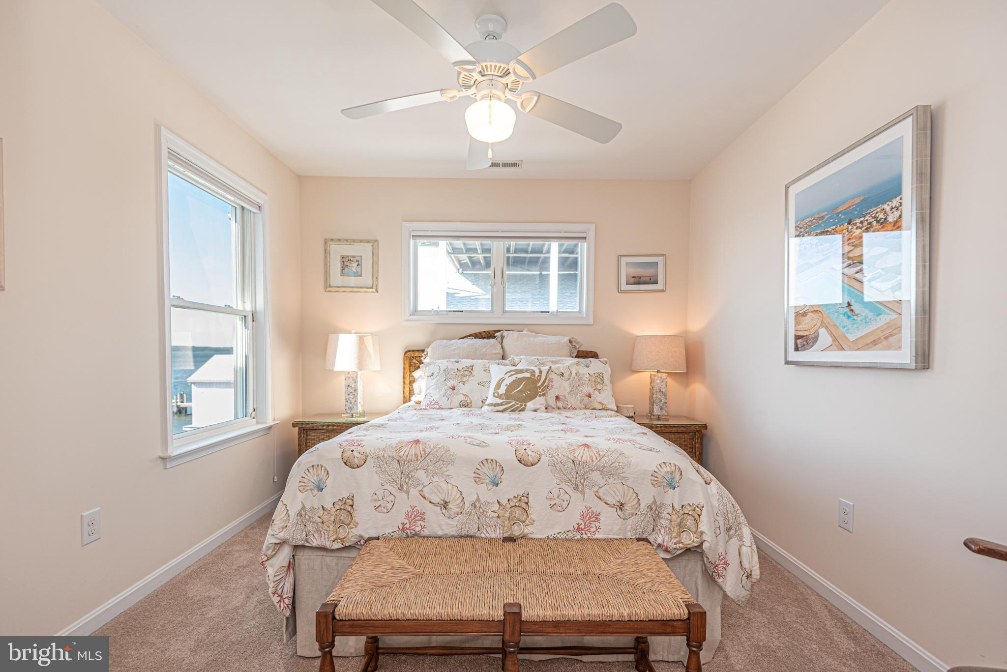 1502 Bay Street Fenwick Island, DE 19944 - Photo 38 of 62 a bedroom with a bed and a window