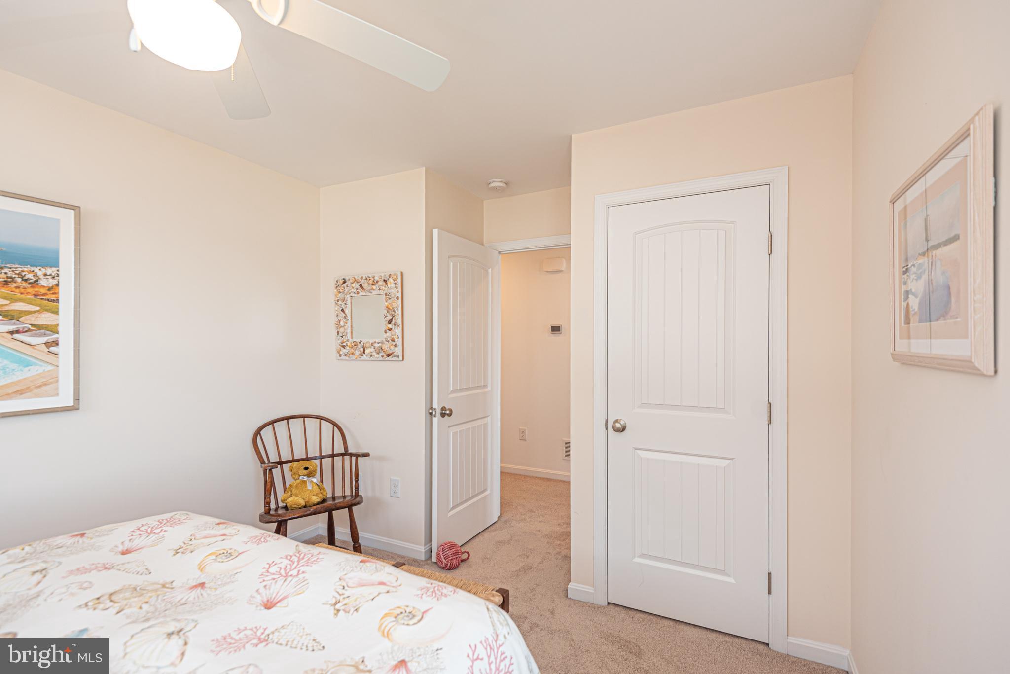 1502 Bay Street Fenwick Island, DE 19944 - Photo 39 of 62 a bedroom with a bed and cabinets