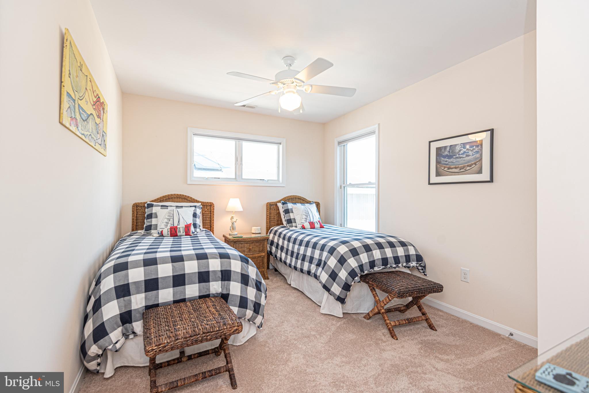 1502 Bay Street Fenwick Island, DE 19944 - Photo 42 of 62 a bedroom with two beds and a lamp