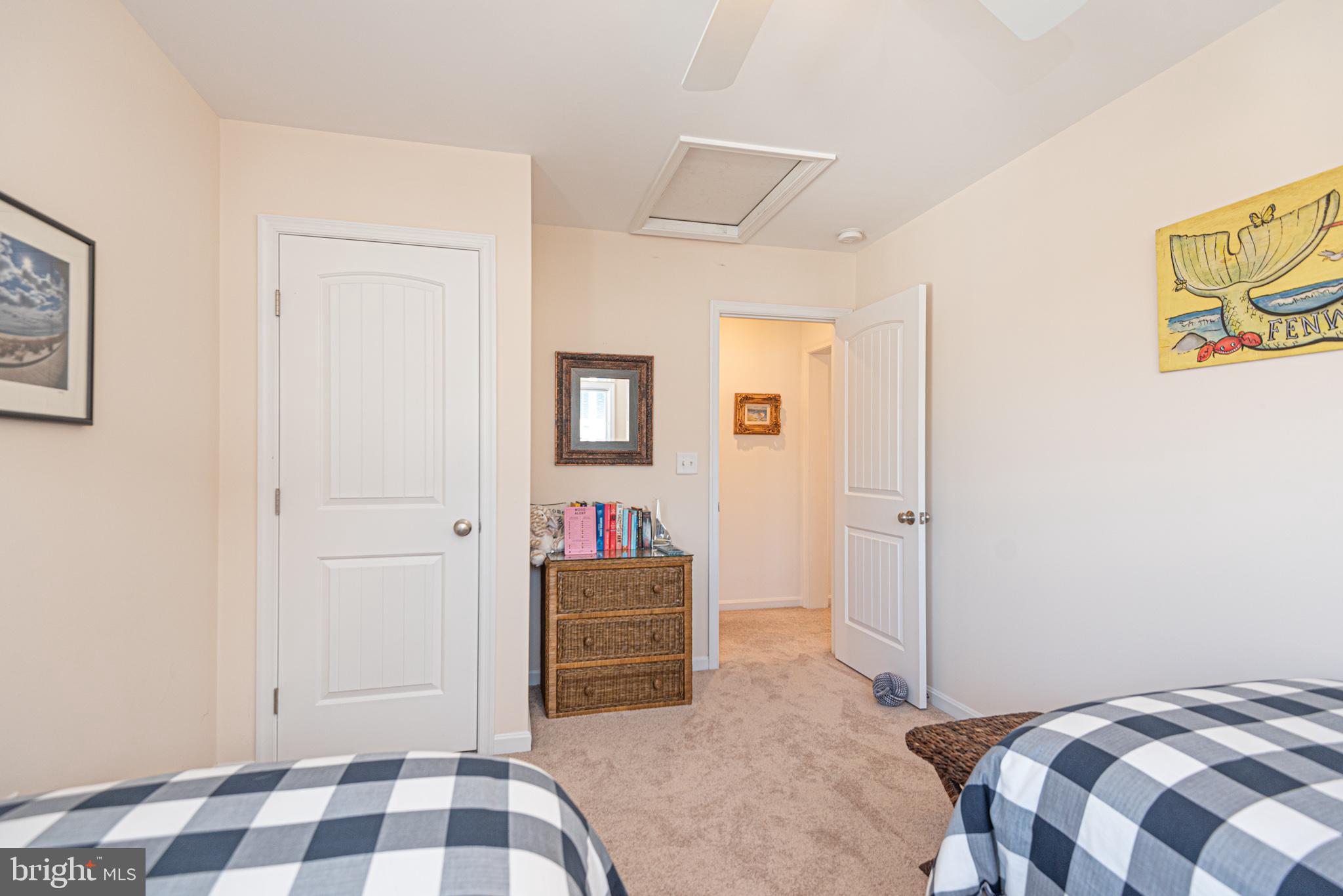 1502 Bay Street Fenwick Island, DE 19944 - Photo 43 of 62 a bedroom with a bed and cabinets