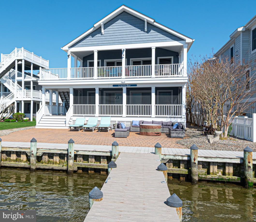 1502 Bay Street Fenwick Island, DE 19944 - Photo 58 of 62 a front view of a building with swimming pool