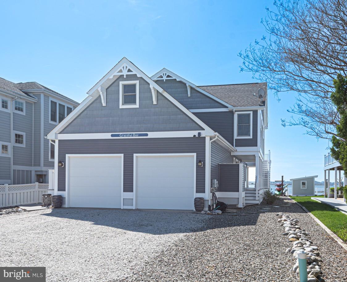 1502 Bay Street Fenwick Island, DE 19944 - Photo 62 of 62 a front view of a house with a yard