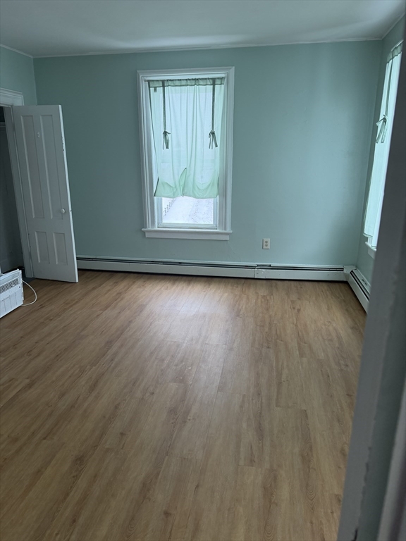 111 Bay, Unit 113 Springfield, MA 01109 - Photo 9 of 13 a view of a room with wooden floor and sliding door