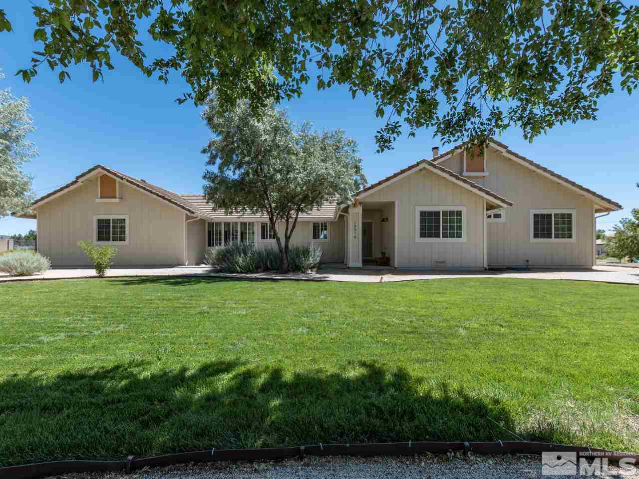 10570 Trailmaster Drive Reno, NV 89508 - Photo 1 of 25 a view of a house with backyard and garden