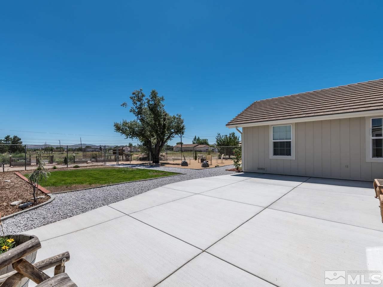 10570 Trailmaster Drive Reno, NV 89508 - Photo 18 of 25 a view of a house with a yard and potted plants