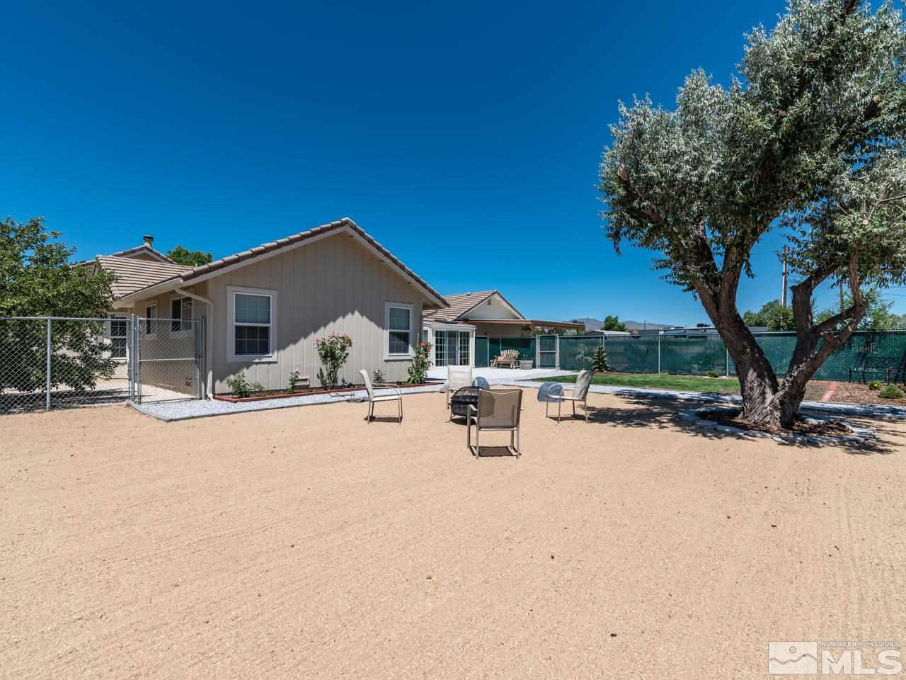 10570 Trailmaster Drive Reno, NV 89508 - Photo 20 of 25 a front view of a house with yard covered with snow in front of it