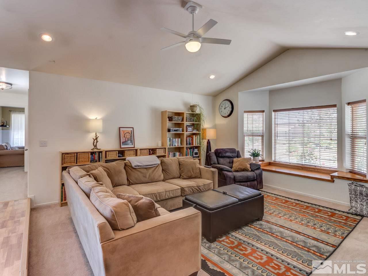 10570 Trailmaster Drive Reno, NV 89508 - Photo 3 of 25 a living room with furniture and a large window