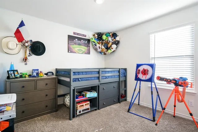 a kitchen that has a lot of cabinets a sink and appliances in it