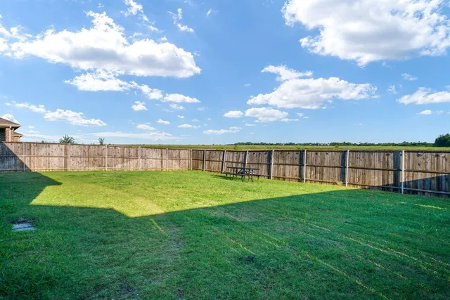 a view of back yard with outdoor space