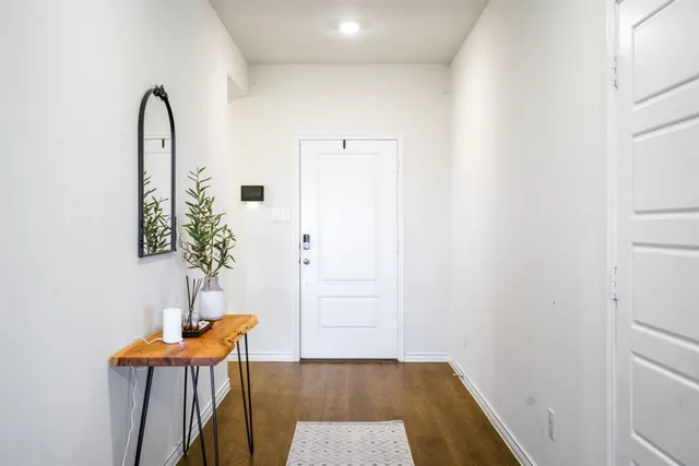 a view of a room with a table and chairs