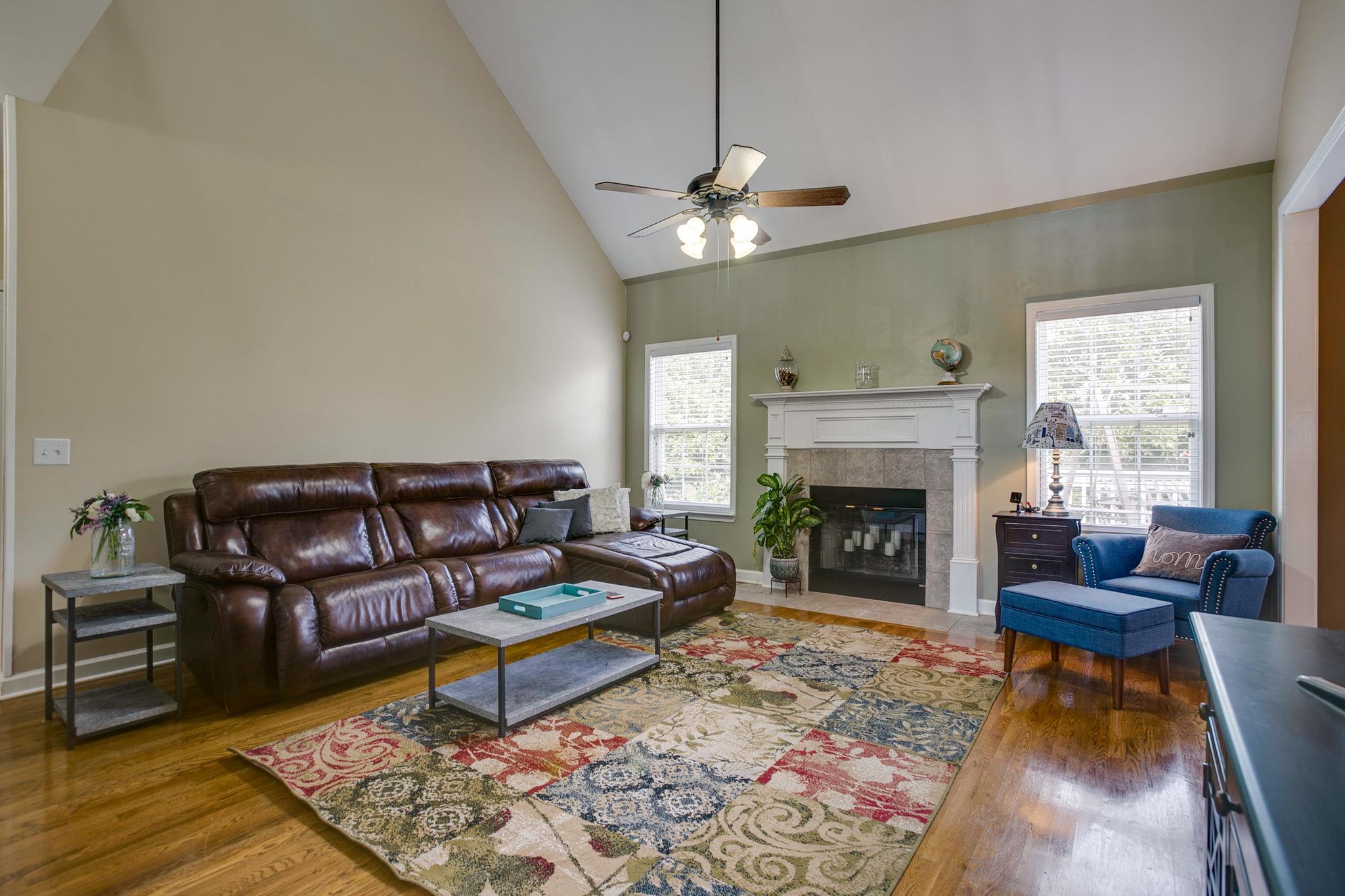 824 Renaissance Avenue Murfreesboro, TN 37129 - Photo 8 of 20 Spacious living room features hardwood floors, gas fireplace and vaulted ceiling