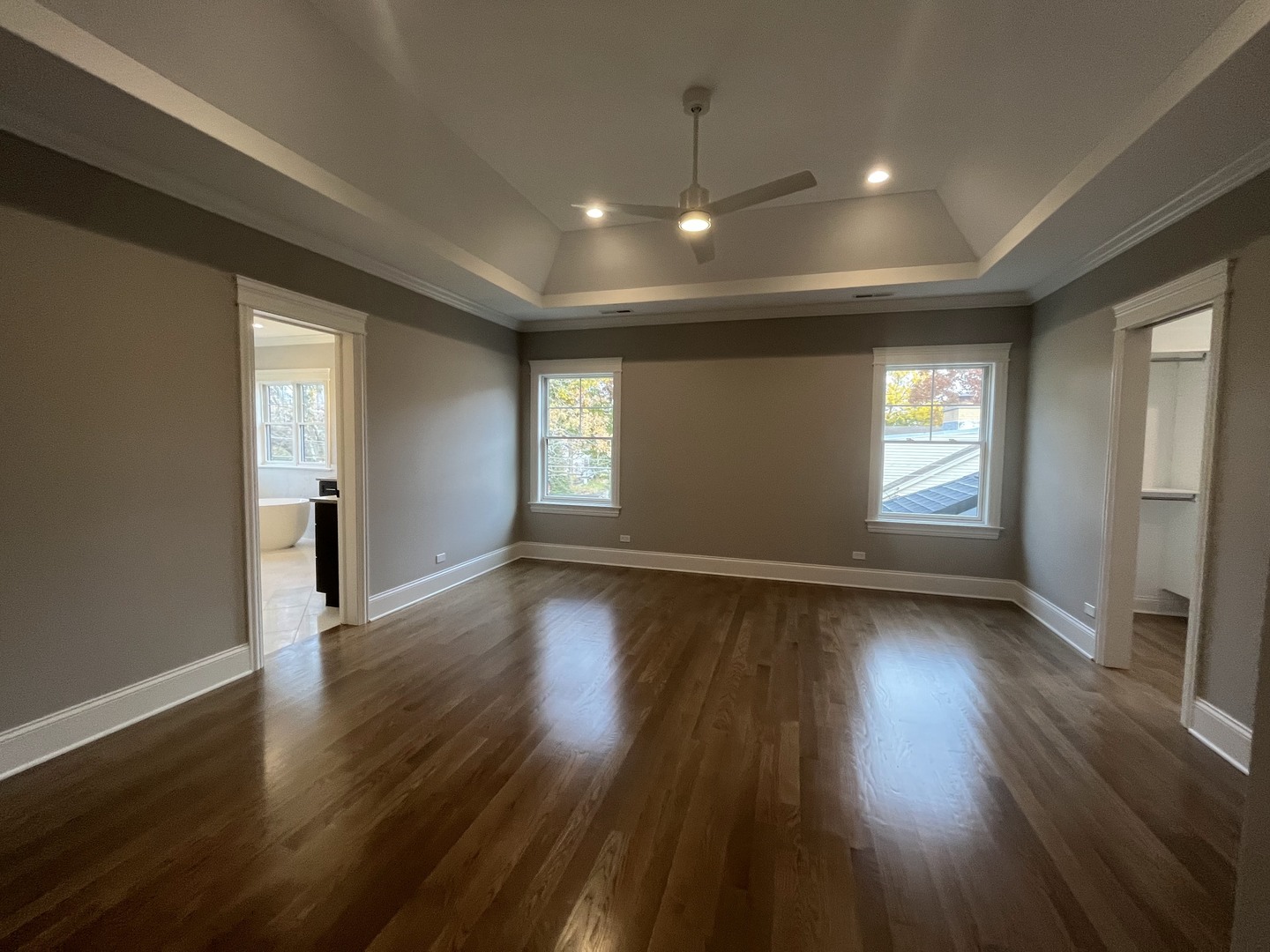 928 Hunter Road Glenview, IL 60025 - Photo 15 of 24 an empty room with wooden floor and windows