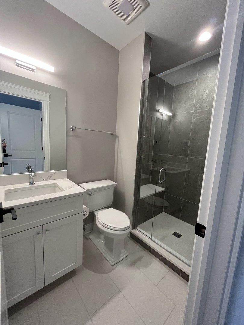 928 Hunter Road Glenview, IL 60025 - Photo 22 of 24 a bathroom with a sink a toilet and shower