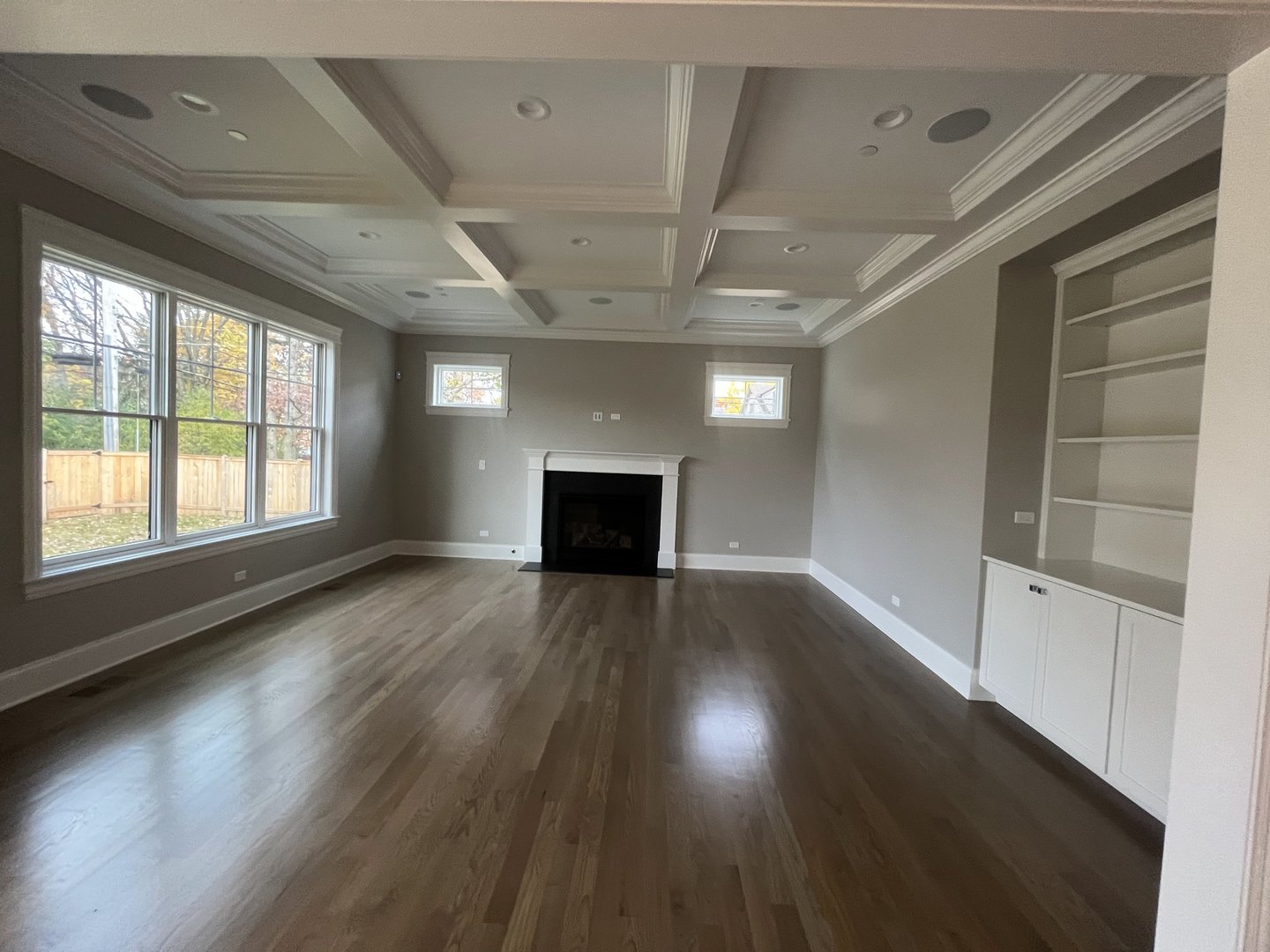 928 Hunter Road Glenview, IL 60025 - Photo 10 of 24 a view of empty room with wooden floor and fireplace