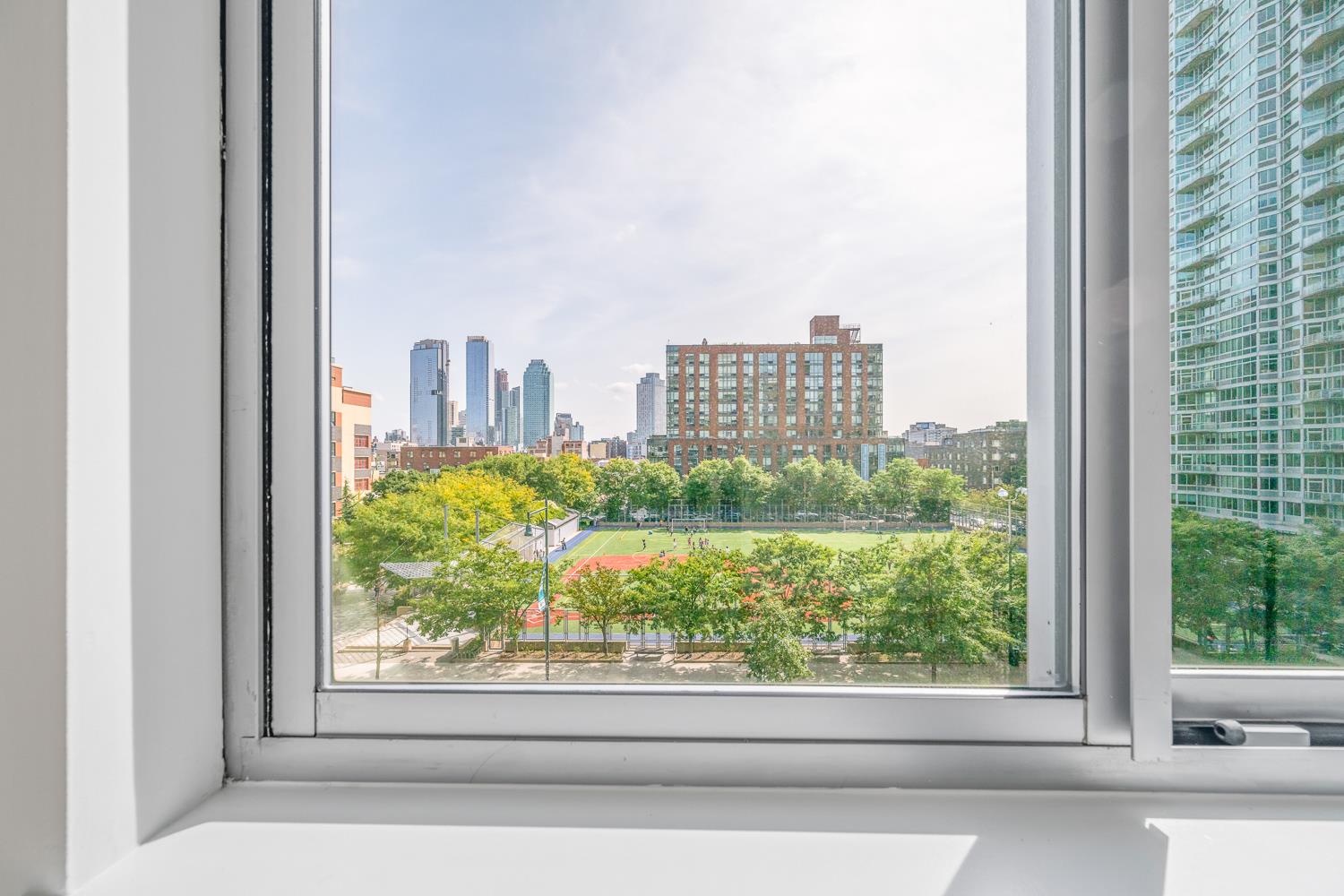 46-30 Center Boulevard, Unit 401 Queens, NY 11109 - Photo 9 of 18 a view of a city from a window