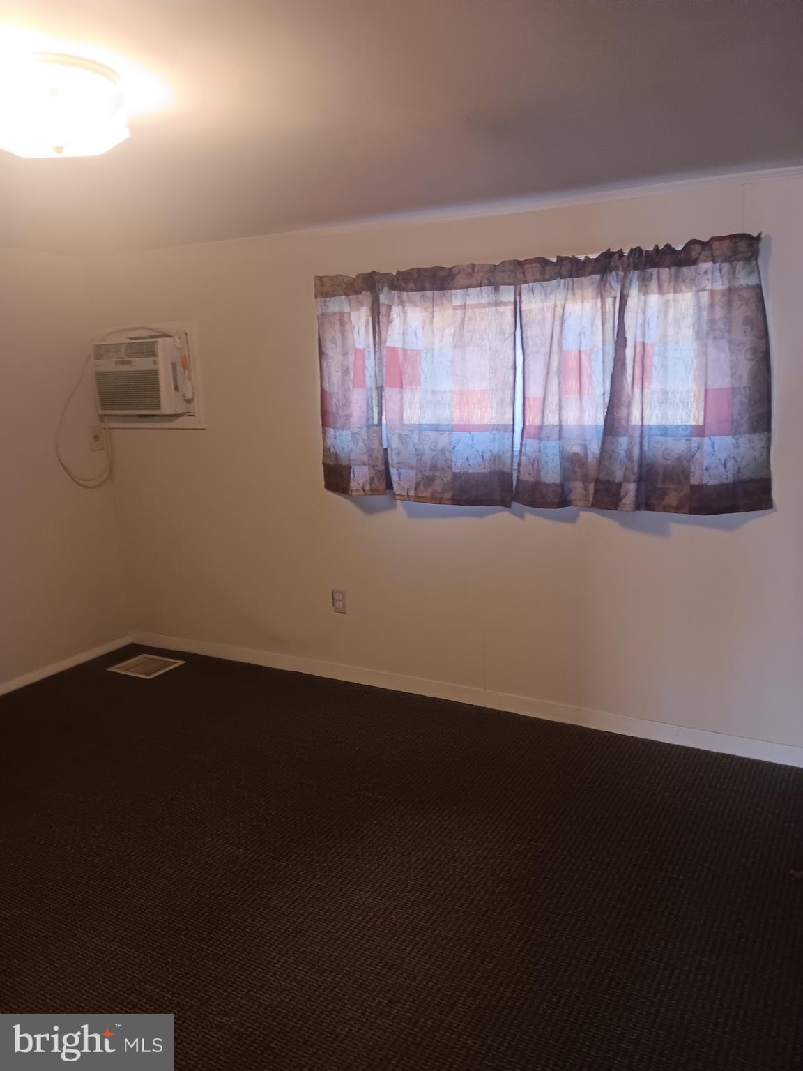 72 Dries Road Reading, PA 19605 - Photo 10 of 11 an empty room with wooden floor and windows