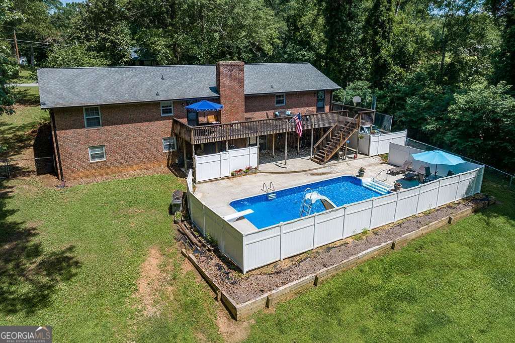 226 Baker Street Statham, GA 30666 - Photo 11 of 63 an aerial view of a house having patio with a yard