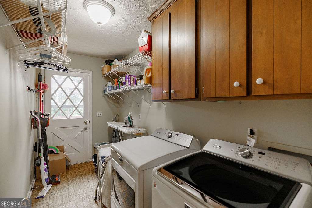 226 Baker Street Statham, GA 30666 - Photo 23 of 63 a utility room with dryer and washer