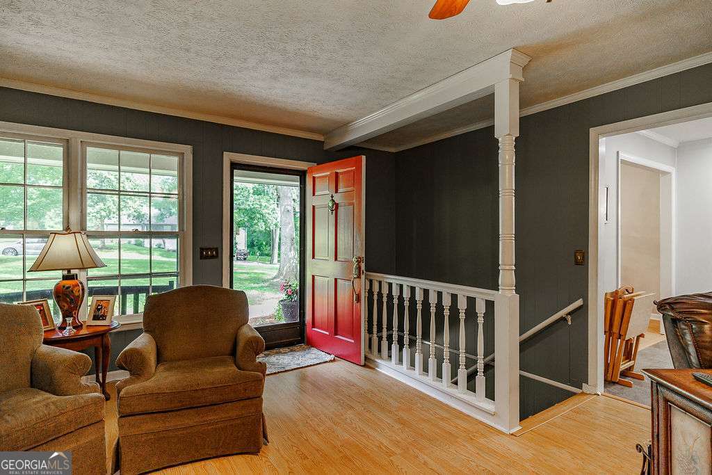 226 Baker Street Statham, GA 30666 - Photo 24 of 63 a living room with furniture stairs and a window