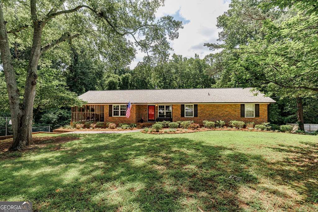 226 Baker Street Statham, GA 30666 - Photo 3 of 63 a view of a house with backyard and sitting area
