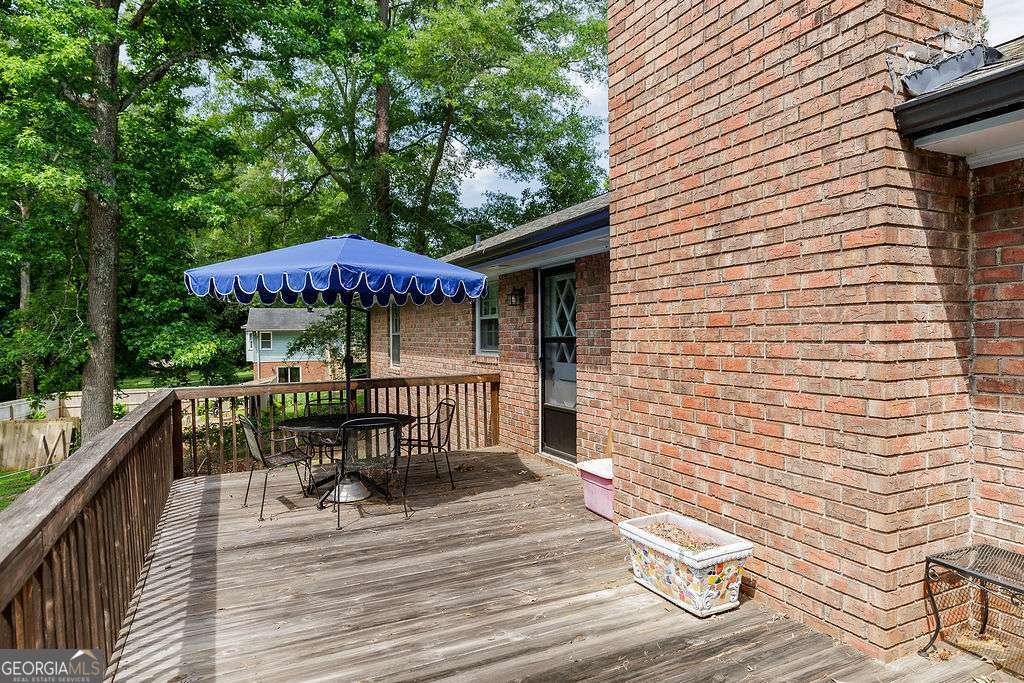 226 Baker Street Statham, GA 30666 - Photo 41 of 63 a view of a patio with wooden floor