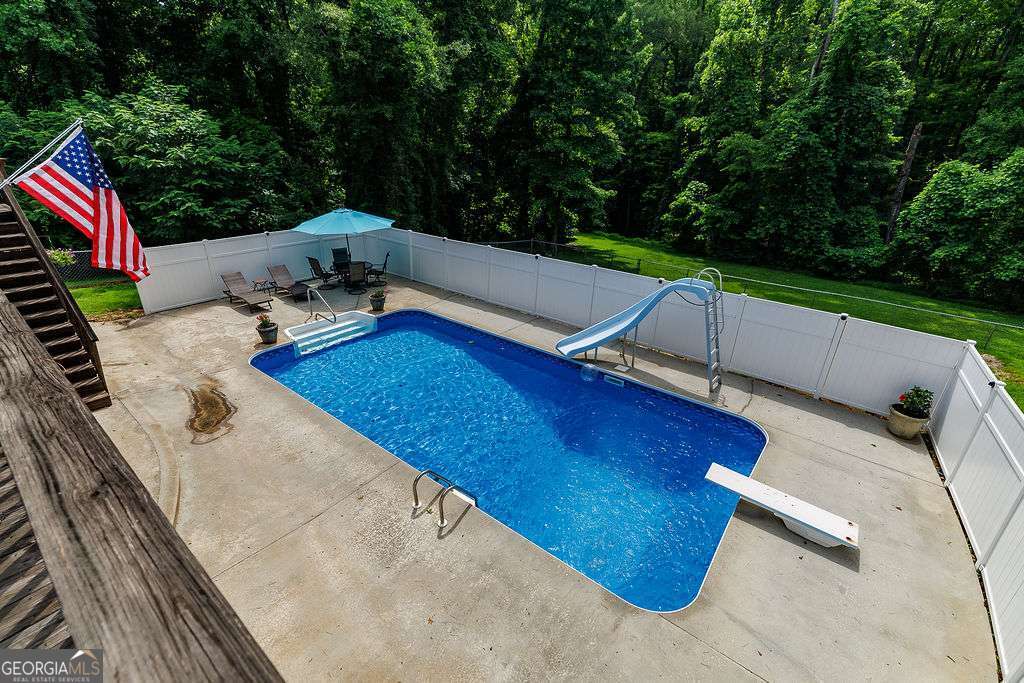 226 Baker Street Statham, GA 30666 - Photo 43 of 63 a view of a backyard with sitting area