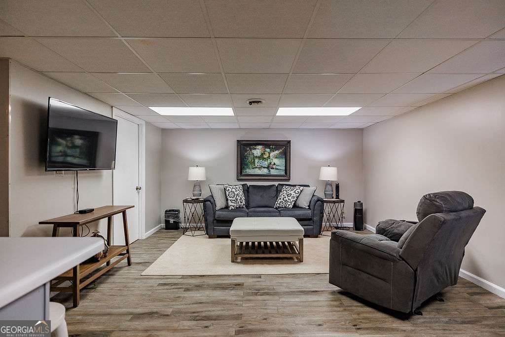 226 Baker Street Statham, GA 30666 - Photo 48 of 63 a living room with furniture and a flat screen tv