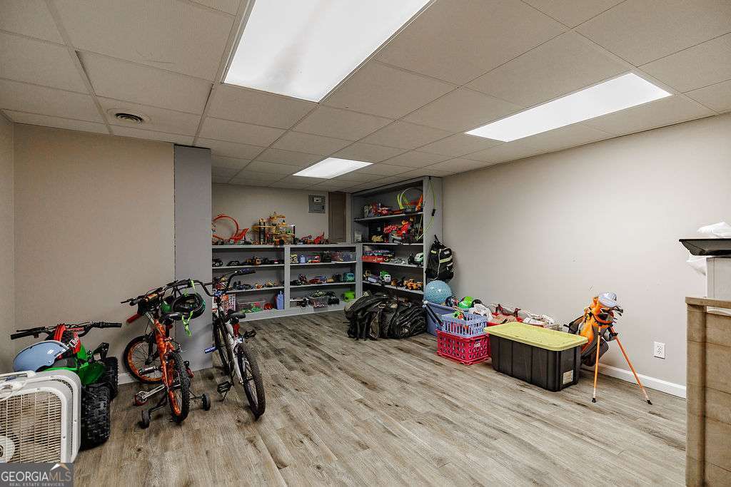 226 Baker Street Statham, GA 30666 - Photo 54 of 63 a room with gym equipment and wooden floor