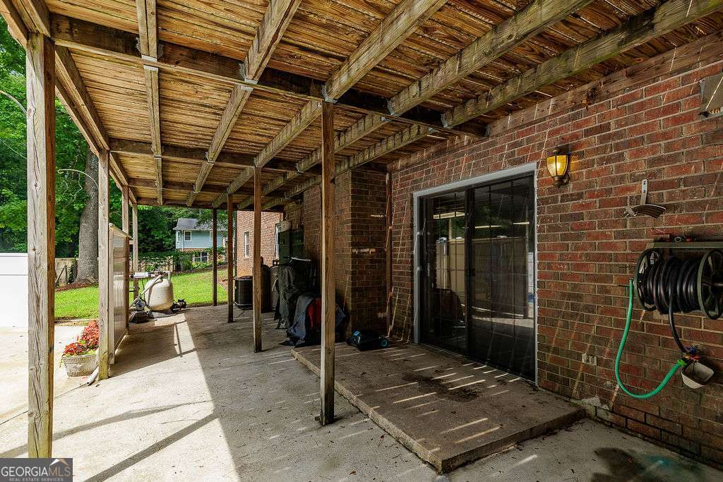 226 Baker Street Statham, GA 30666 - Photo 56 of 63 a view of a porch with furniture and a yard