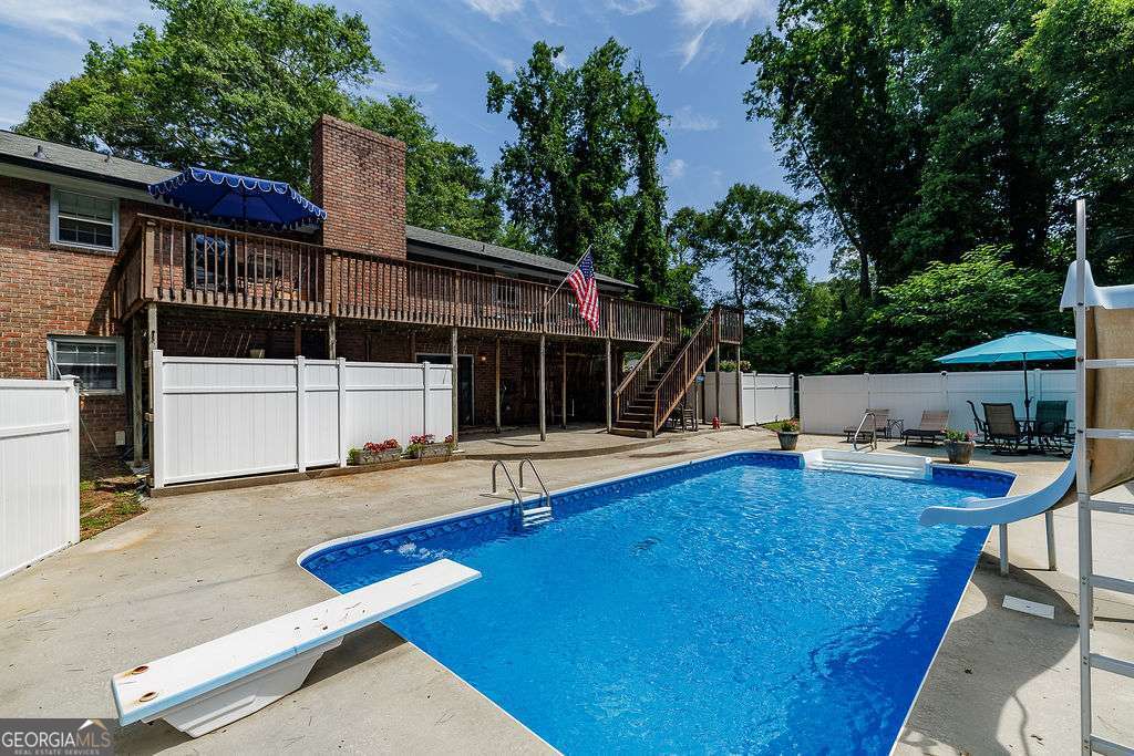 226 Baker Street Statham, GA 30666 - Photo 58 of 63 swimming pool view with a seating space and garden