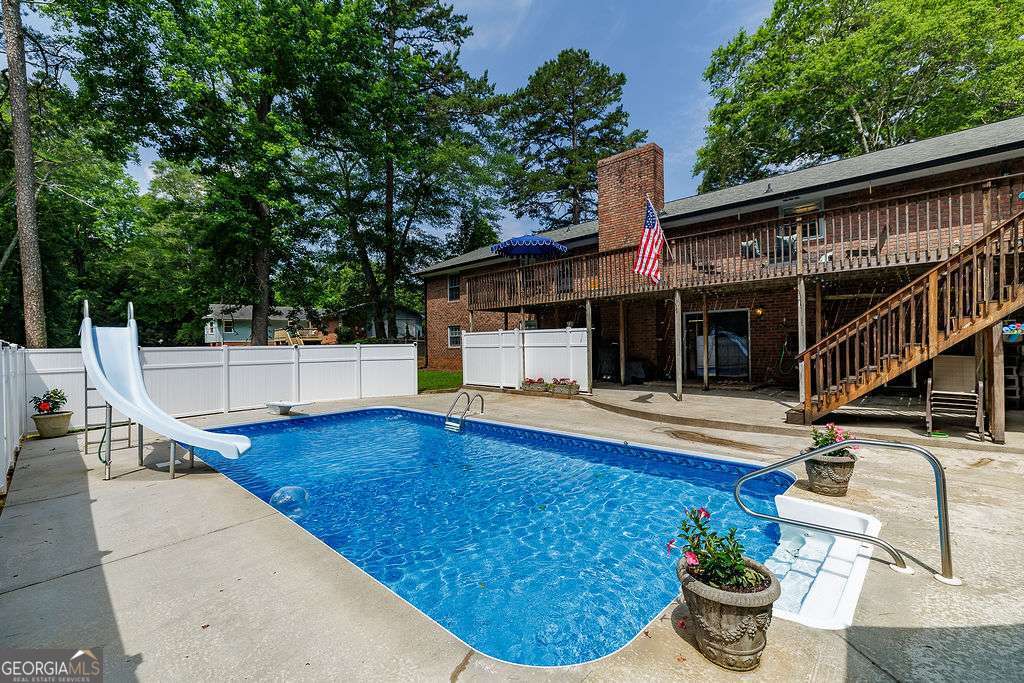 226 Baker Street Statham, GA 30666 - Photo 59 of 63 a view of a house with backyard and sitting area