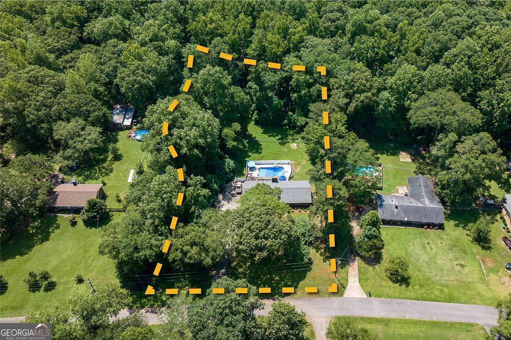 226 Baker Street Statham, GA 30666 - Photo 6 of 63 an aerial view of residential house with outdoor space and trees all around