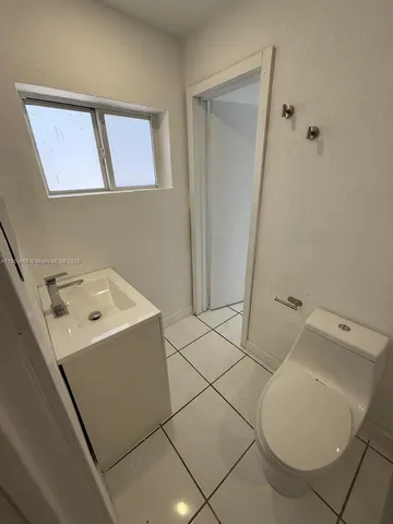 a bathroom with a toilet and a sink