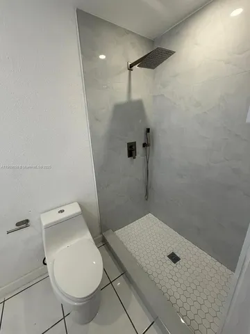 a kitchen with a sink and a stove top oven