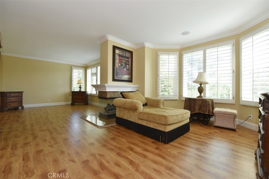 12 Brigadier Irvine, CA 92603 - Photo 35 of 50 a spacious bedroom with a bed couch table and two large window