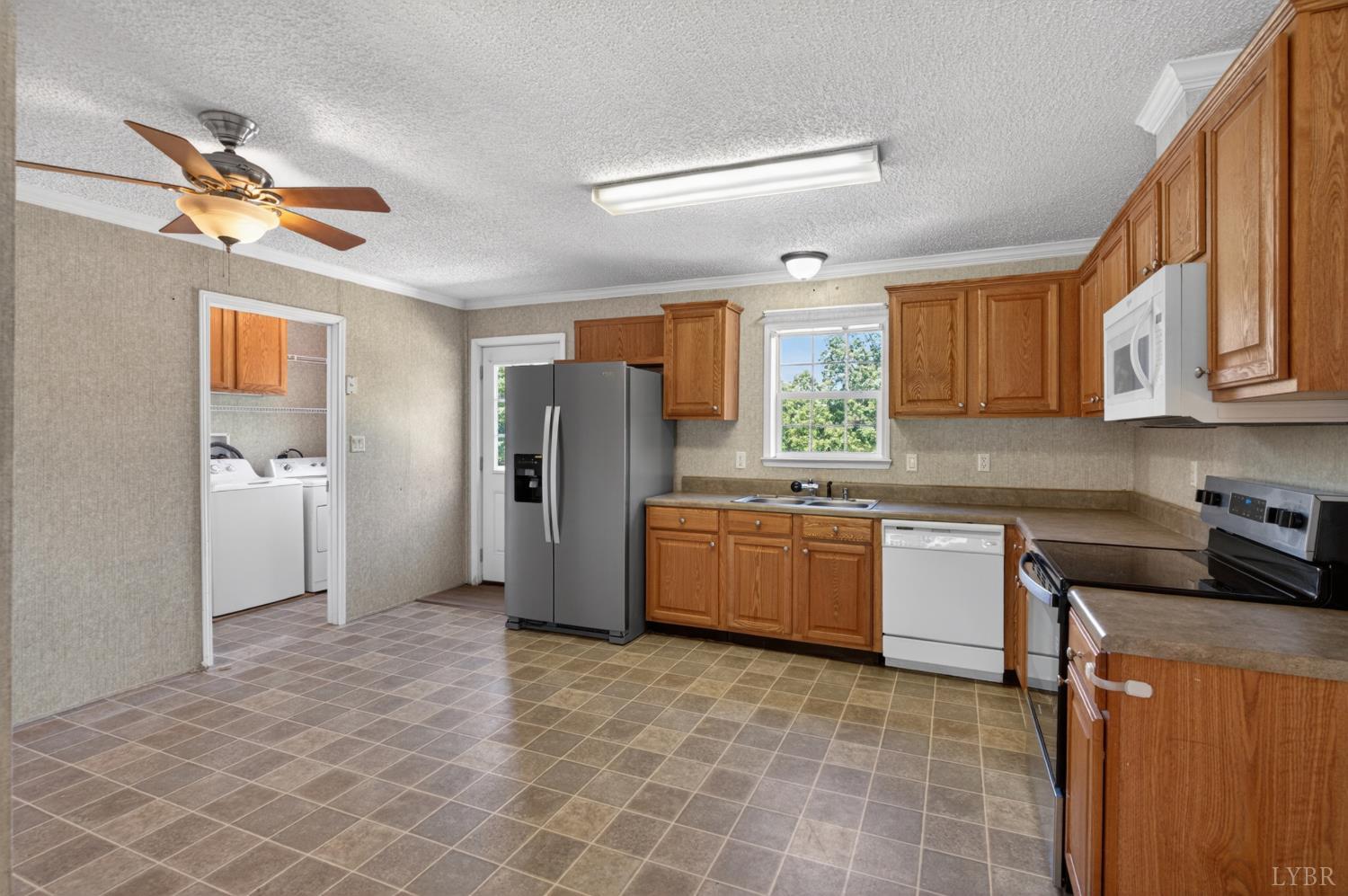 1811 Mohawk Road Gladys, VA 24554 - Photo 14 of 51 a kitchen with stainless steel appliances granite countertop a refrigerator sink and stove
